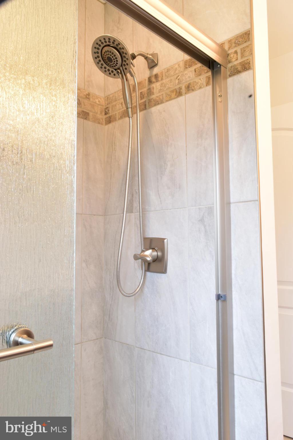 11514 Seven Locks Road Potomac, MD 20854 - Photo 37 of 72 a bathroom with a shower