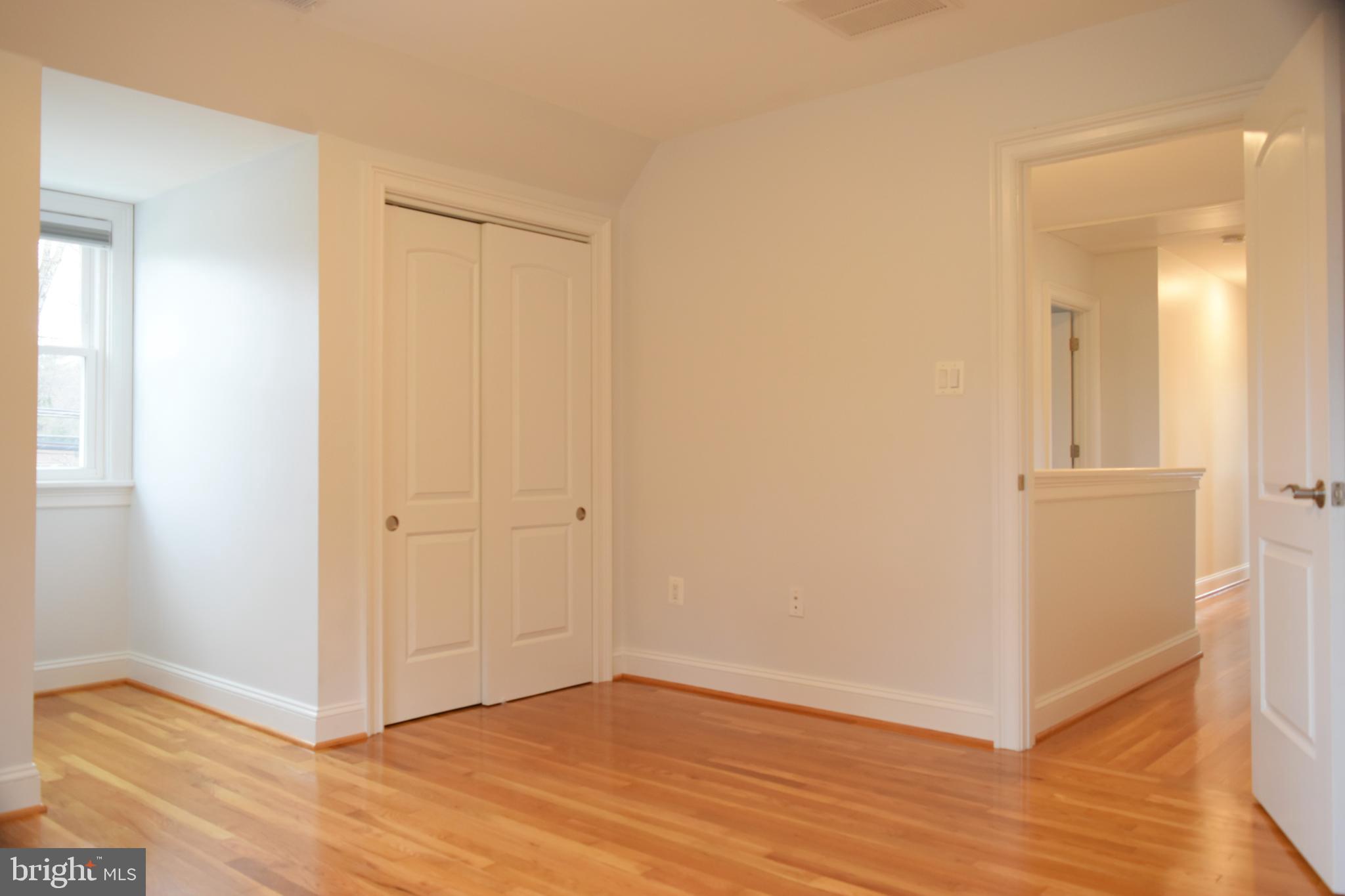 11514 Seven Locks Road Potomac, MD 20854 - Photo 46 of 72 a view of a hallway with wooden floor