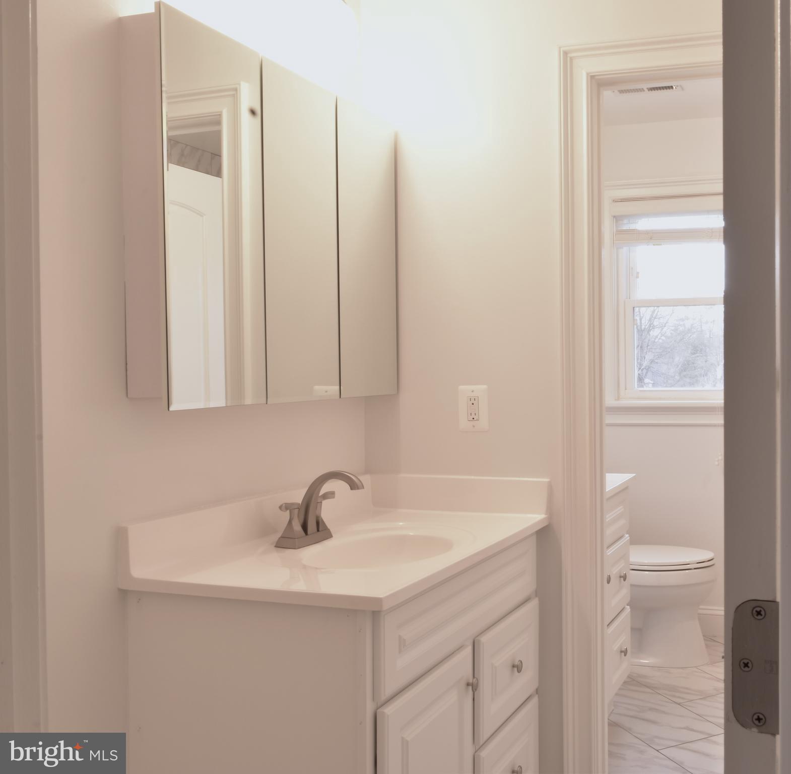 11514 Seven Locks Road Potomac, MD 20854 - Photo 48 of 72 a bathroom with a sink and a vanity