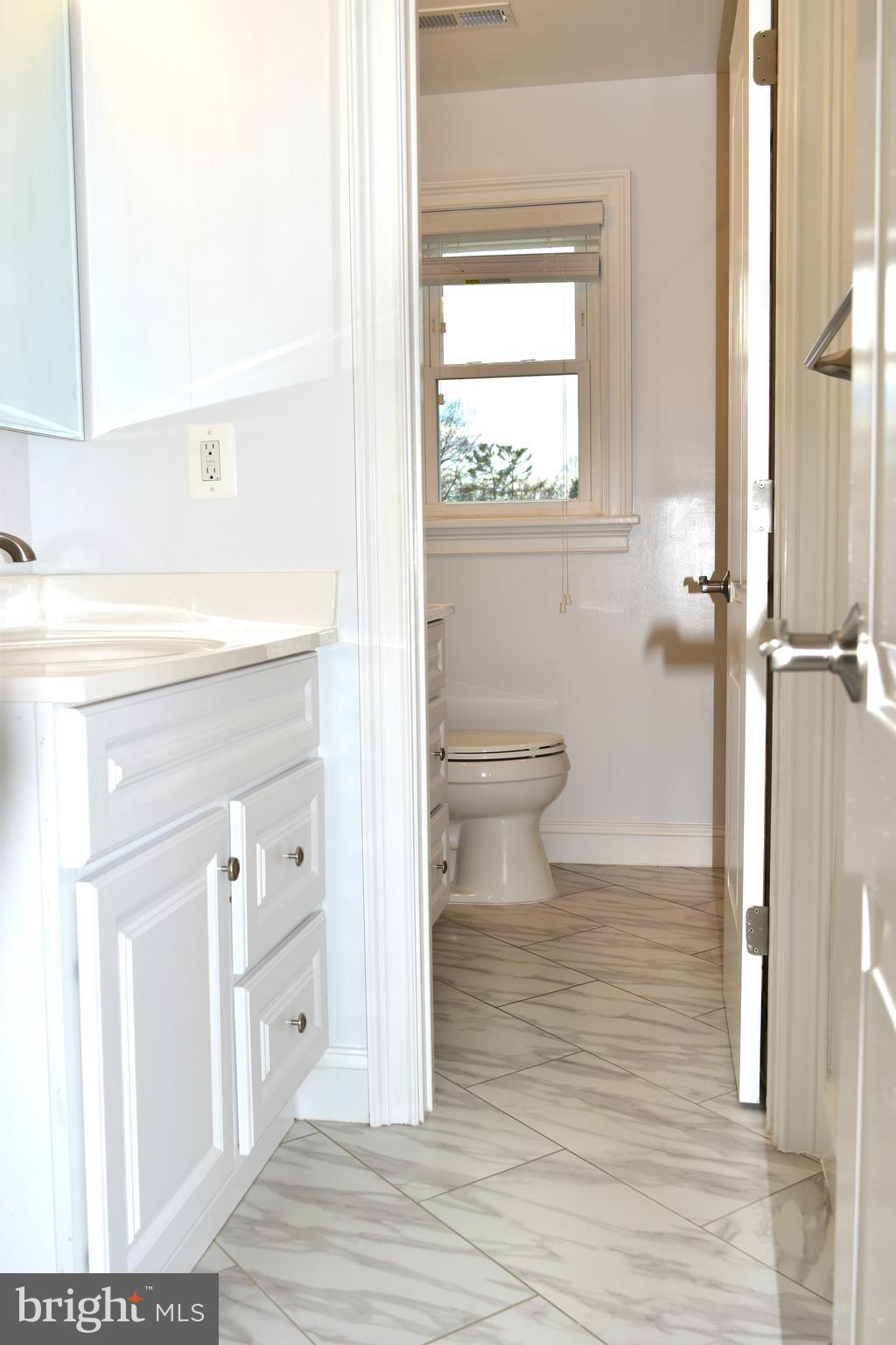11514 Seven Locks Road Potomac, MD 20854 - Photo 49 of 72 a bathroom with a toilet and a shower