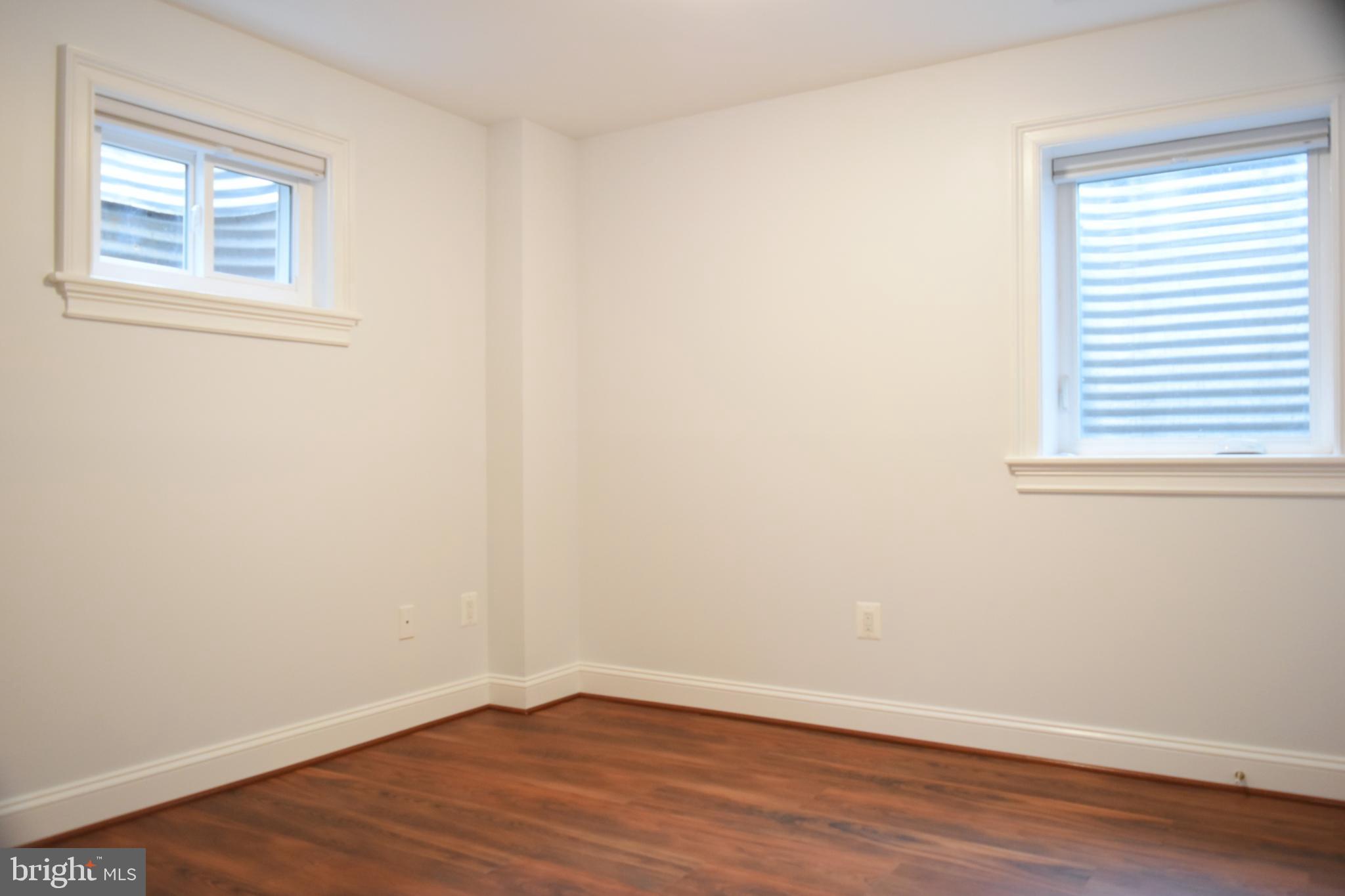 11514 Seven Locks Road Potomac, MD 20854 - Photo 54 of 72 a view of a small space with wooden floor and a window