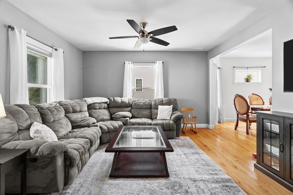146 South Pleasant Street, Unit 146 Haverhill, MA 01835 - Photo 11 of 28 a living room with furniture wooden floor and a window
