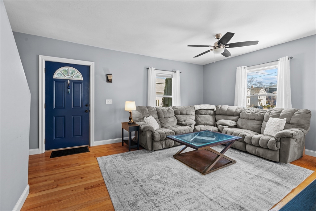 146 South Pleasant Street, Unit 146 Haverhill, MA 01835 - Photo 13 of 28 a living room with furniture a rug and a window