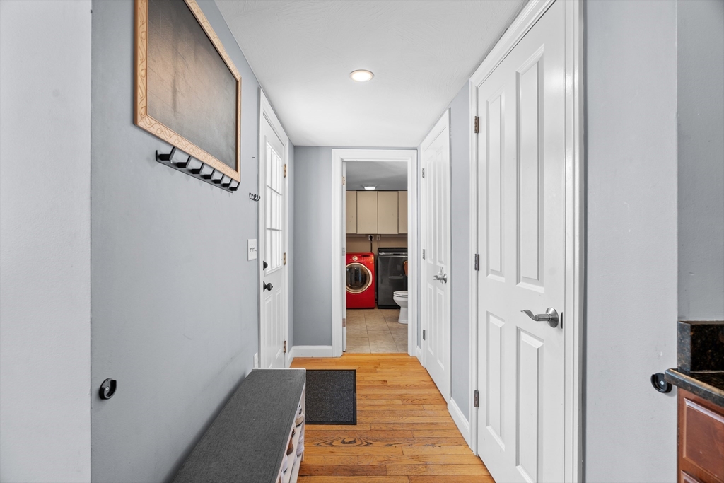 146 South Pleasant Street, Unit 146 Haverhill, MA 01835 - Photo 14 of 28 a view of a hallway with wooden floor and staircase