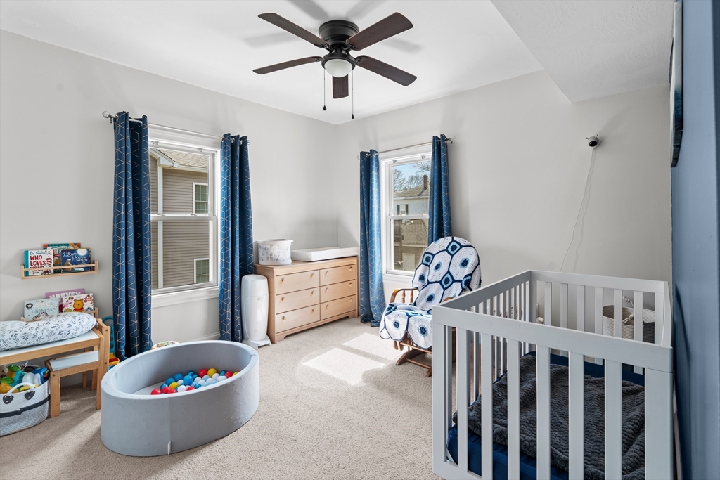 146 South Pleasant Street, Unit 146 Haverhill, MA 01835 - Photo 18 of 28 a living room with furniture and a table