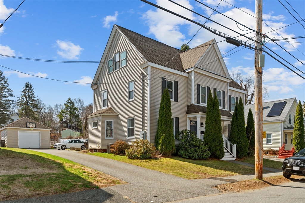 146 South Pleasant Street, Unit 146 Haverhill, MA 01835 - Photo 2 of 28 a view of a white house with a outdoor space