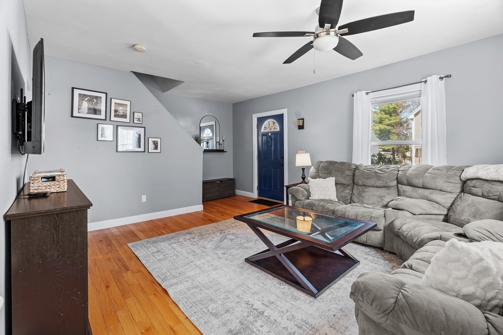 146 South Pleasant Street, Unit 146 Haverhill, MA 01835 - Photo 10 of 28 a living room with furniture and a flat screen tv