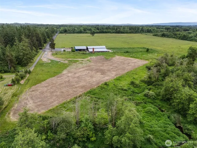 a view of a field with a big yard