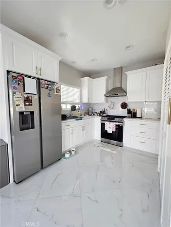 a kitchen with a stove and cabinets