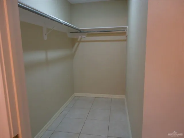 a view of an empty walk in closet