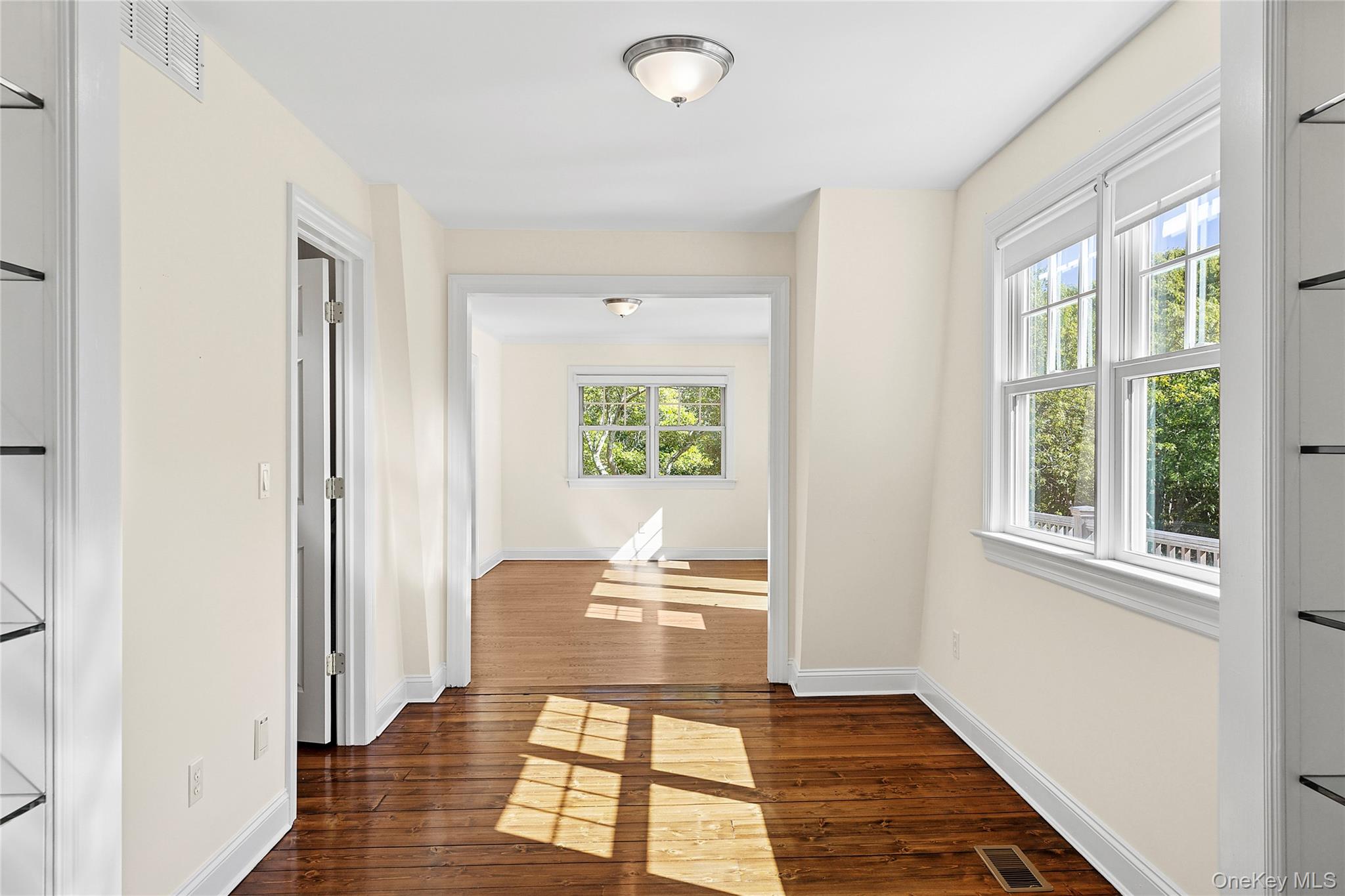 22 Old Trail Road Water Mill, NY 11976 - Photo 13 of 38 a bedroom with a bed and a window