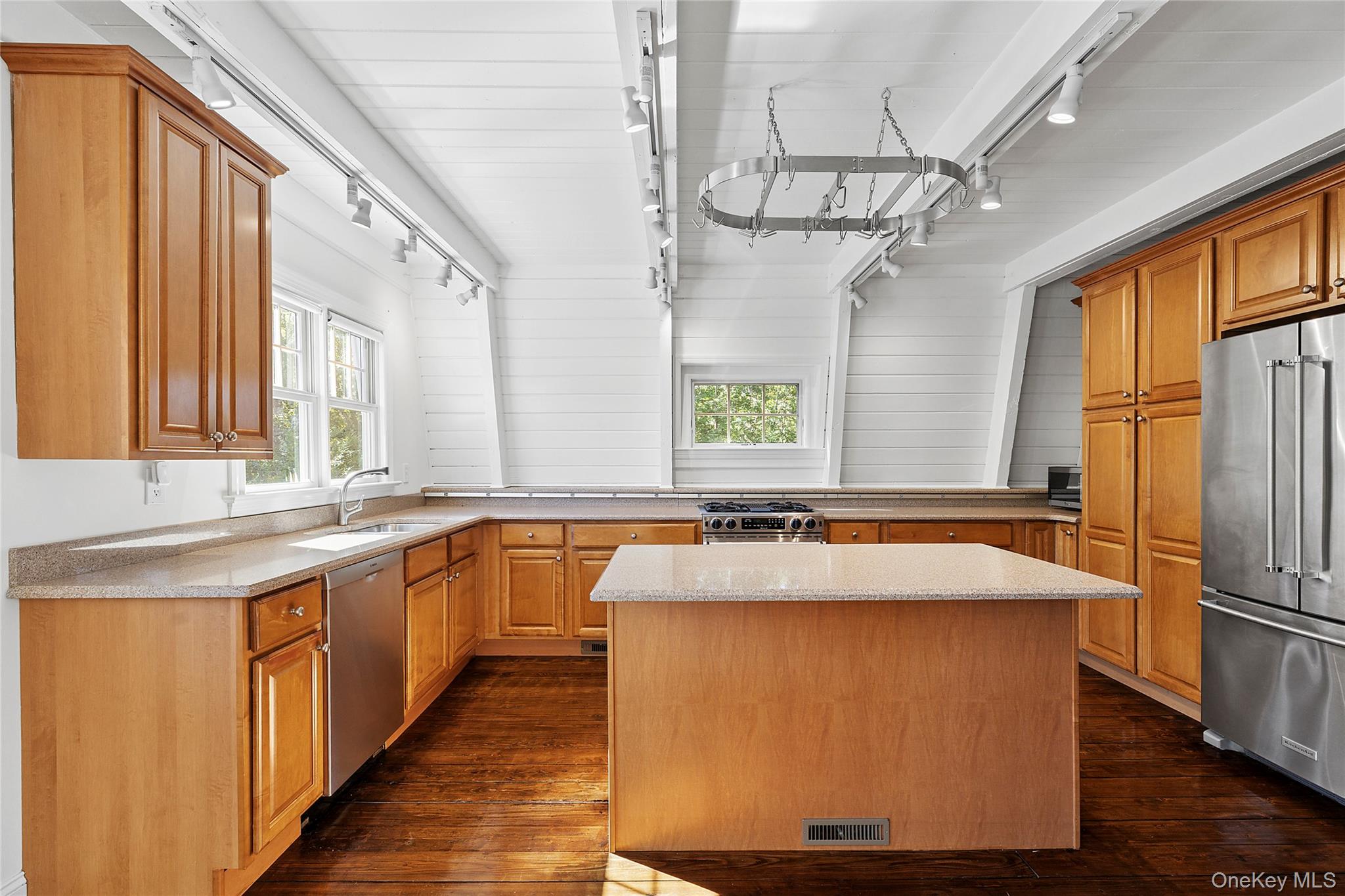 22 Old Trail Road Water Mill, NY 11976 - Photo 14 of 38 a large kitchen with kitchen island a large window a sink and appliances