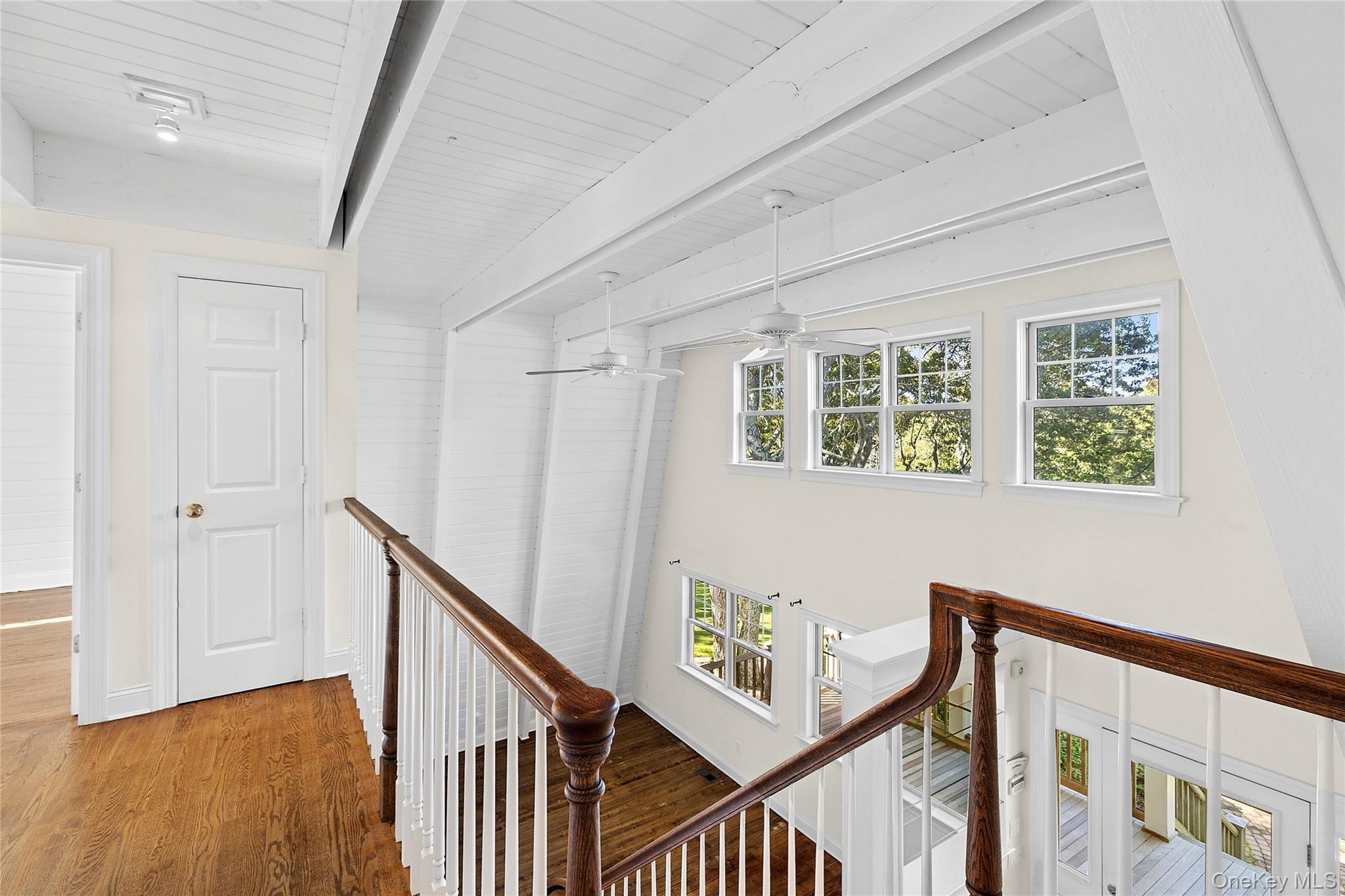 22 Old Trail Road Water Mill, NY 11976 - Photo 17 of 38 a view of an entryway with wooden floor