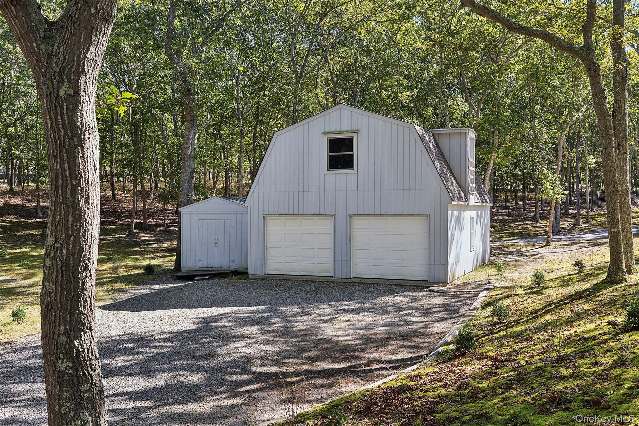 22 Old Trail Road Water Mill, NY 11976 - Photo 32 of 38 a view of backyard of house
