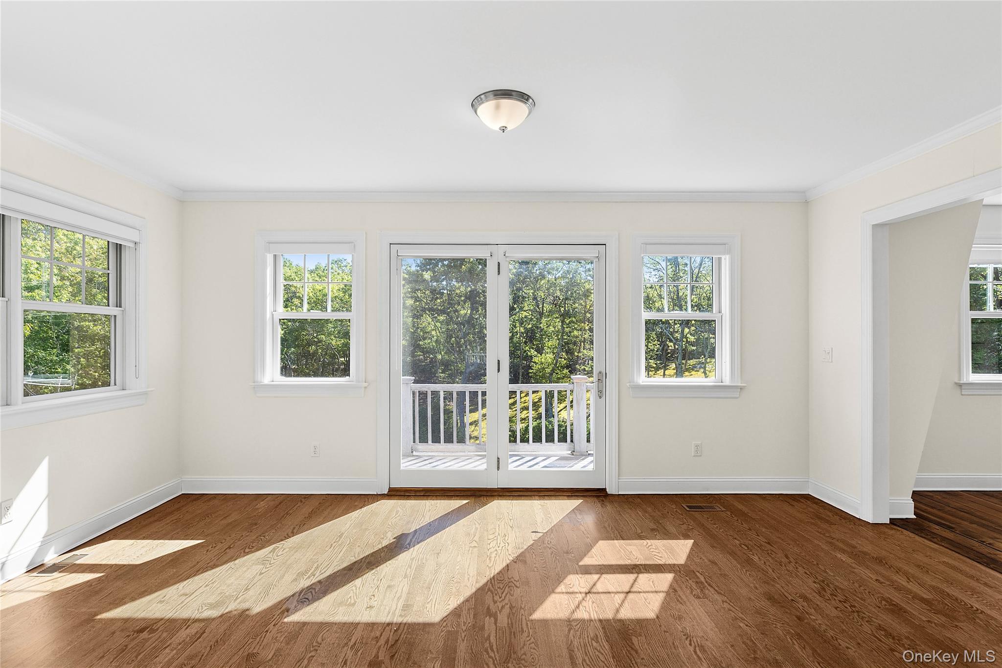 22 Old Trail Road Water Mill, NY 11976 - Photo 9 of 38 a view of an empty room with a window