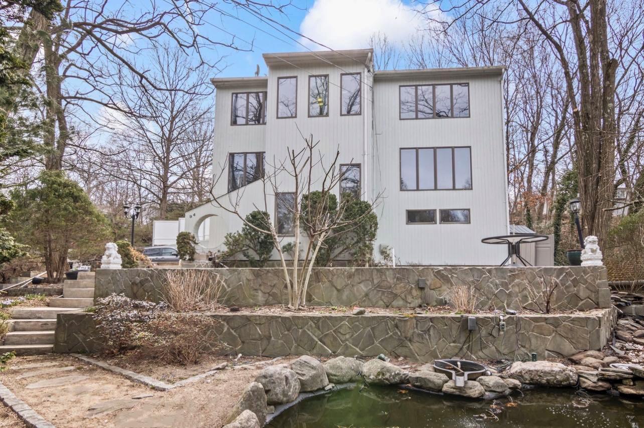 94 Abbott Drive Halesite, NY 11743 - Photo 1 of 1 a front view of a house with a yard