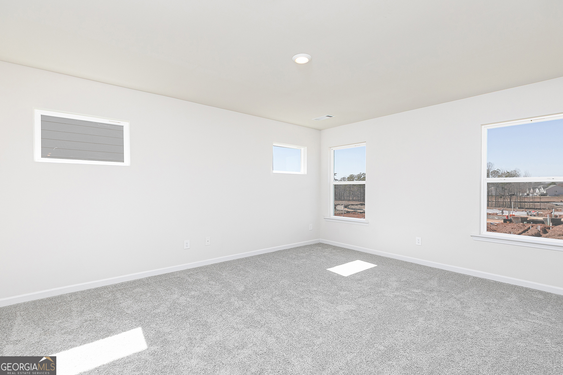 661 Mackenzie Cove Villa Rica, GA 30180 - Photo 13 of 18 an empty room with windows