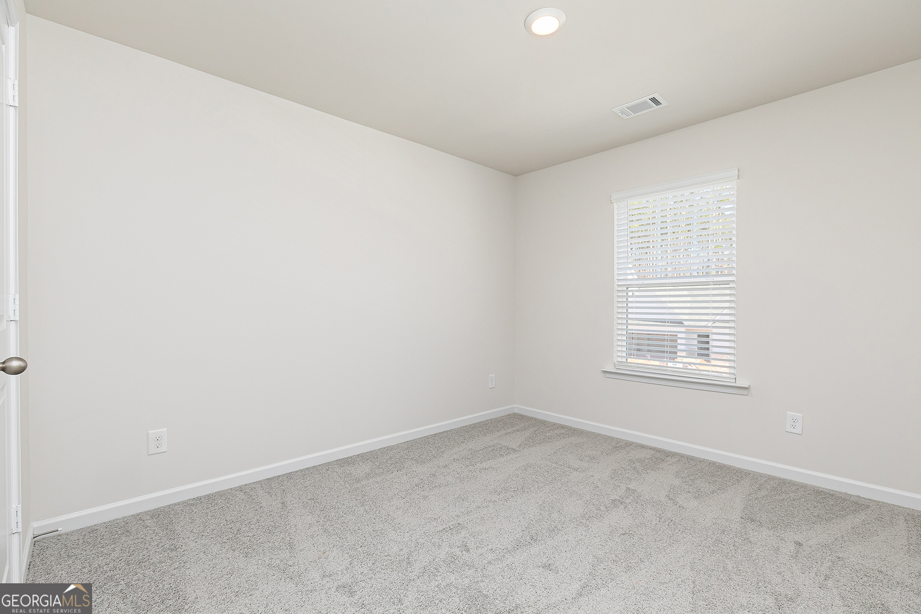 661 Mackenzie Cove Villa Rica, GA 30180 - Photo 16 of 18 an empty room with a window