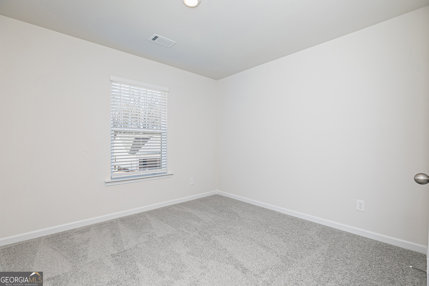 661 Mackenzie Cove Villa Rica, GA 30180 - Photo 17 of 18 an empty room with a window