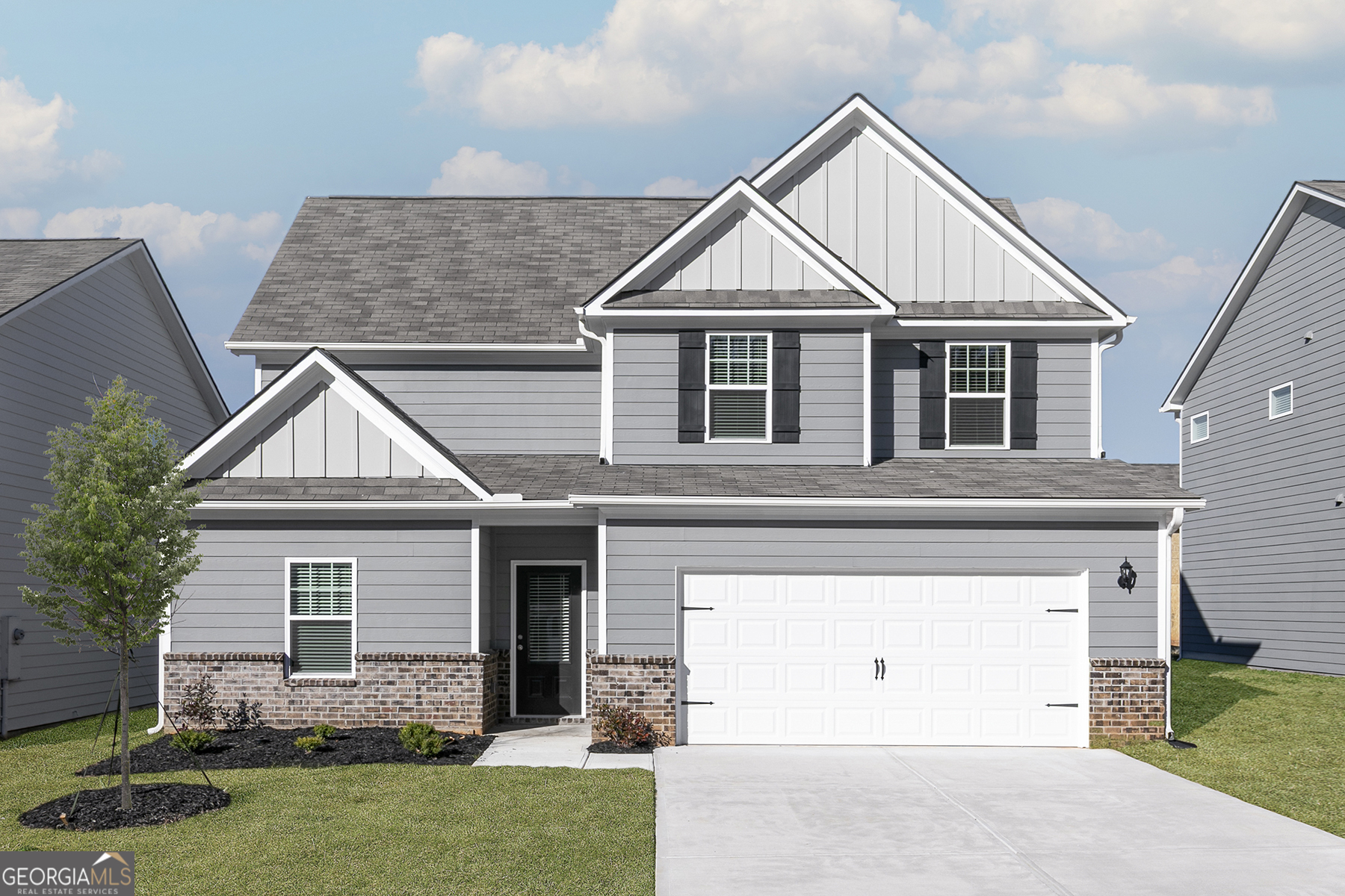 661 Mackenzie Cove Villa Rica, GA 30180 - Photo 2 of 18 a front view of a house with a yard and garage