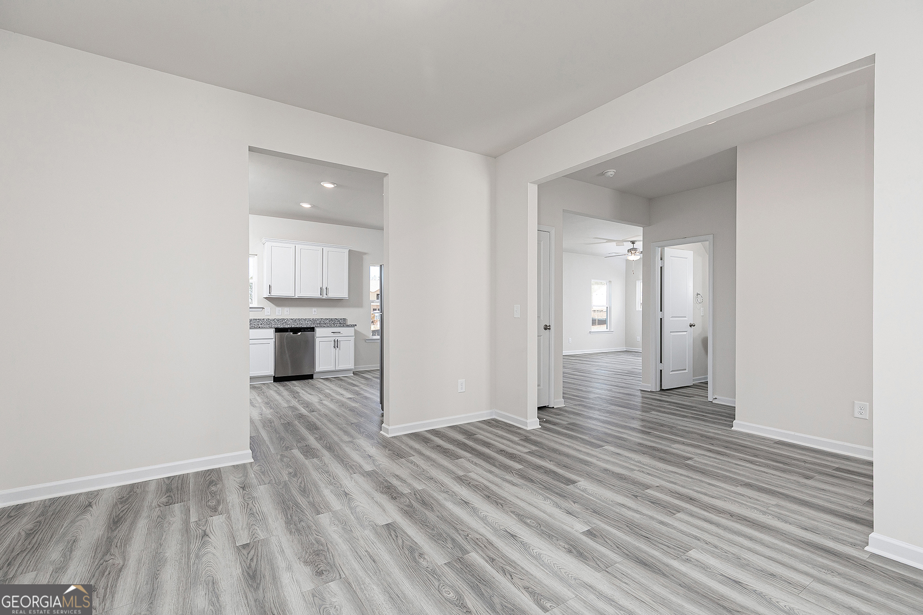 661 Mackenzie Cove Villa Rica, GA 30180 - Photo 5 of 18 an empty room with wooden floor and windows