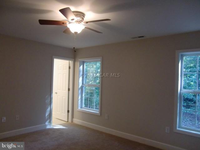 27 Canal Road Ocean Pines, MD 21811 - Photo 14 of 23 a view of an empty room with a window