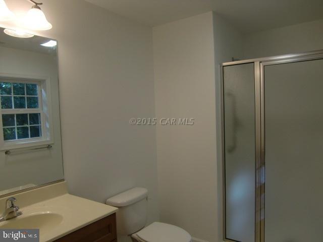 27 Canal Road Ocean Pines, MD 21811 - Photo 16 of 23 a bathroom with a sink a toilet and shower
