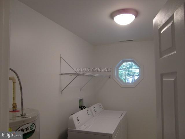 27 Canal Road Ocean Pines, MD 21811 - Photo 23 of 23 a view of a bathroom with a sink and a mirror