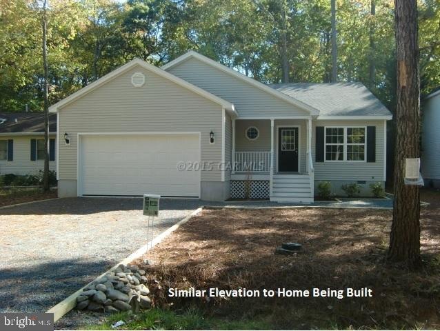 27 Canal Road Ocean Pines, MD 21811 - Photo 4 of 23 a house view with a yard