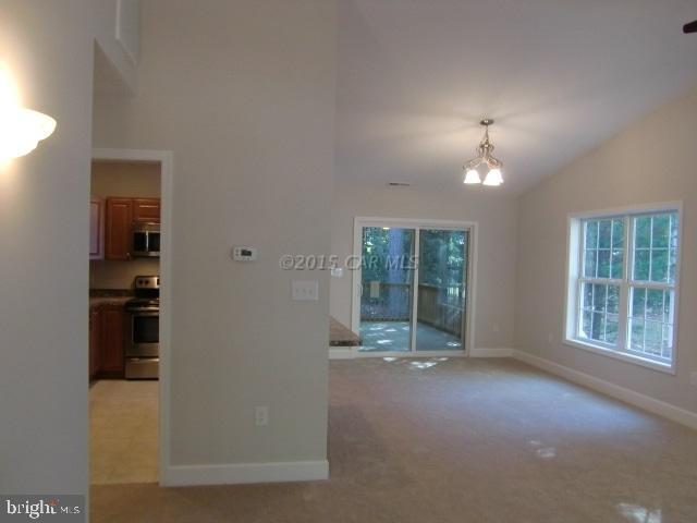 27 Canal Road Ocean Pines, MD 21811 - Photo 5 of 23 an empty room with windows and closet