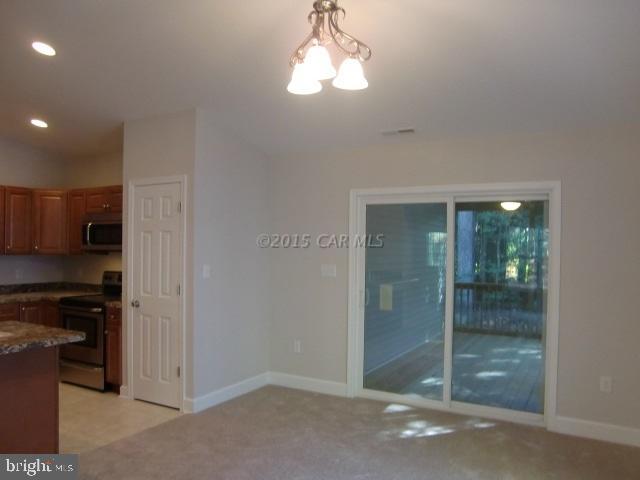 27 Canal Road Ocean Pines, MD 21811 - Photo 7 of 23 a view of a kitchen
