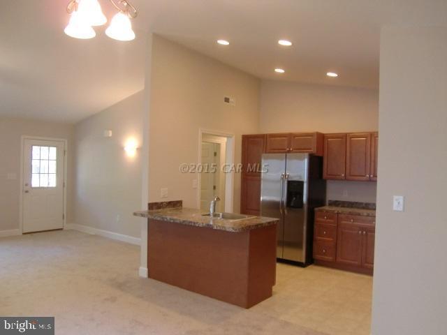 27 Canal Road Ocean Pines, MD 21811 - Photo 9 of 23 a view of kitchen with refrigerator and window