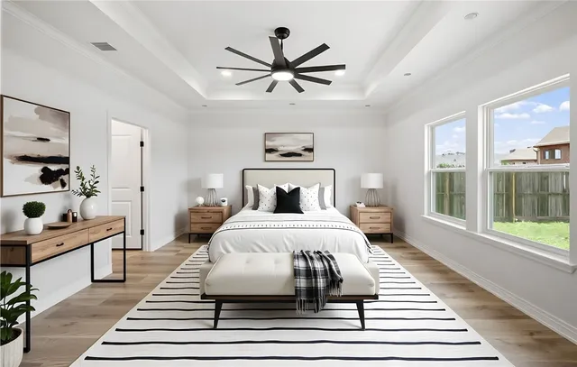 a bedroom with a large bed and a window