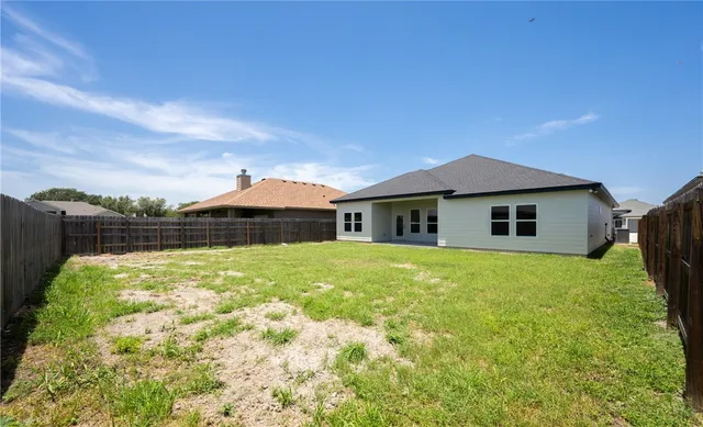 a house view with a garden space