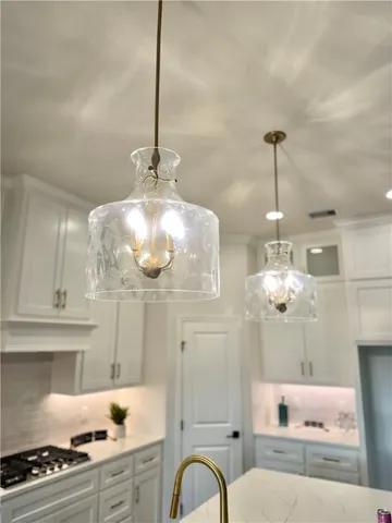 a very nice looking dining room with a chandelier