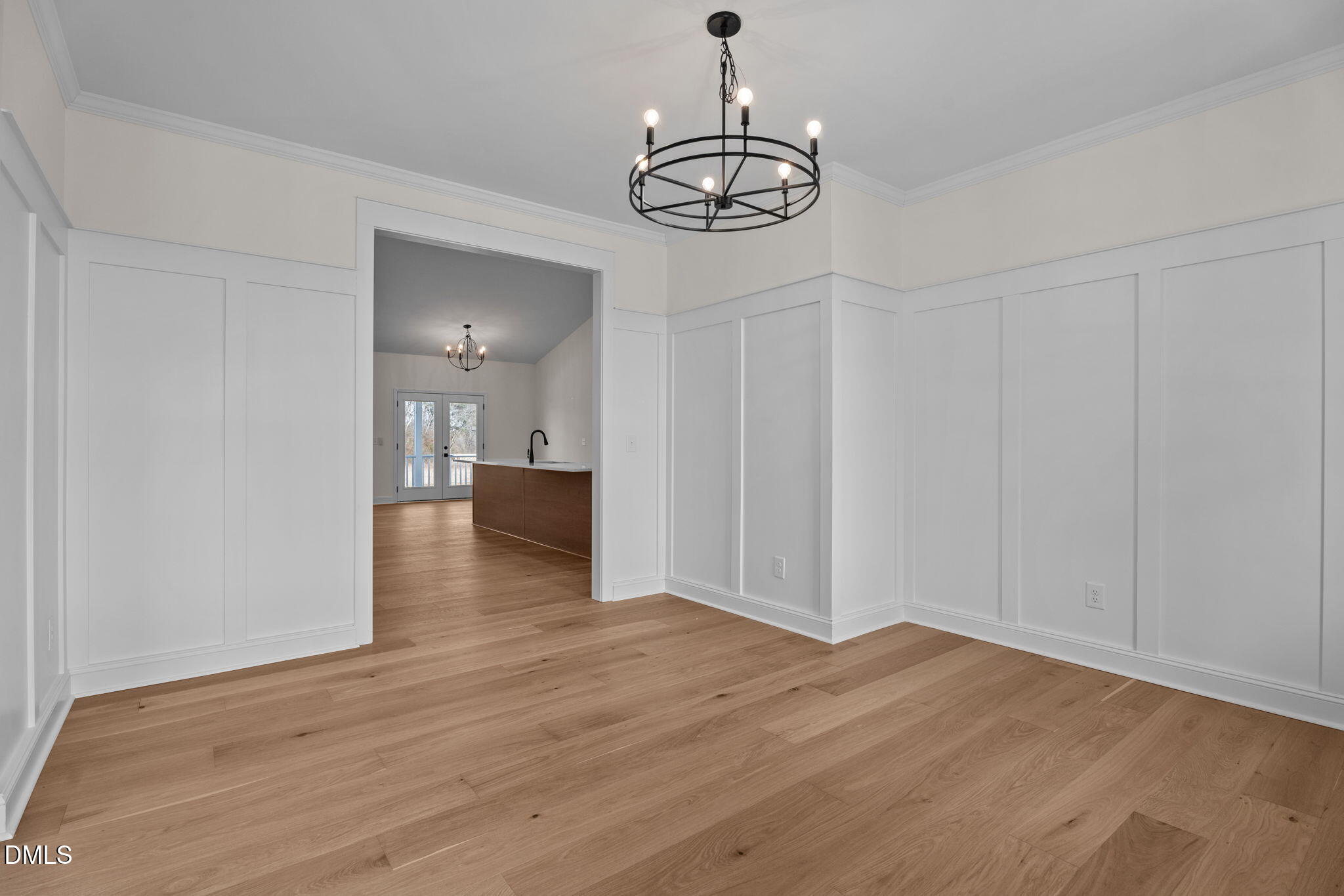 2396 Heartland Road Battleboro, NC 27809 - Photo 21 of 49 a view of a hallway with wooden floor and chandelier