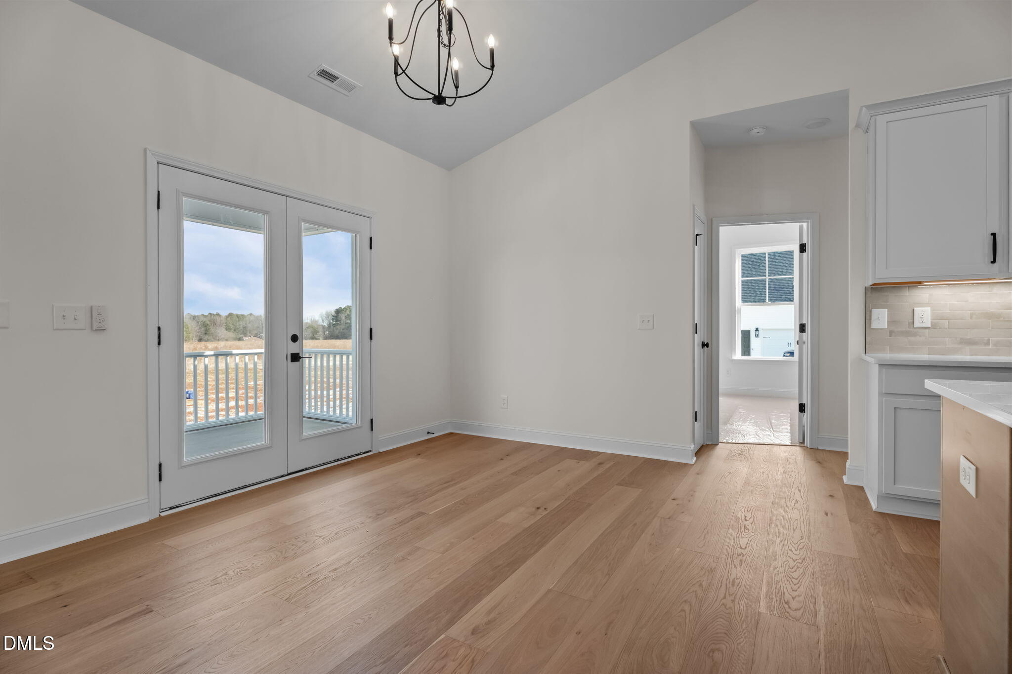 2396 Heartland Road Battleboro, NC 27809 - Photo 30 of 49 wooden floor in an empty room with a fireplace