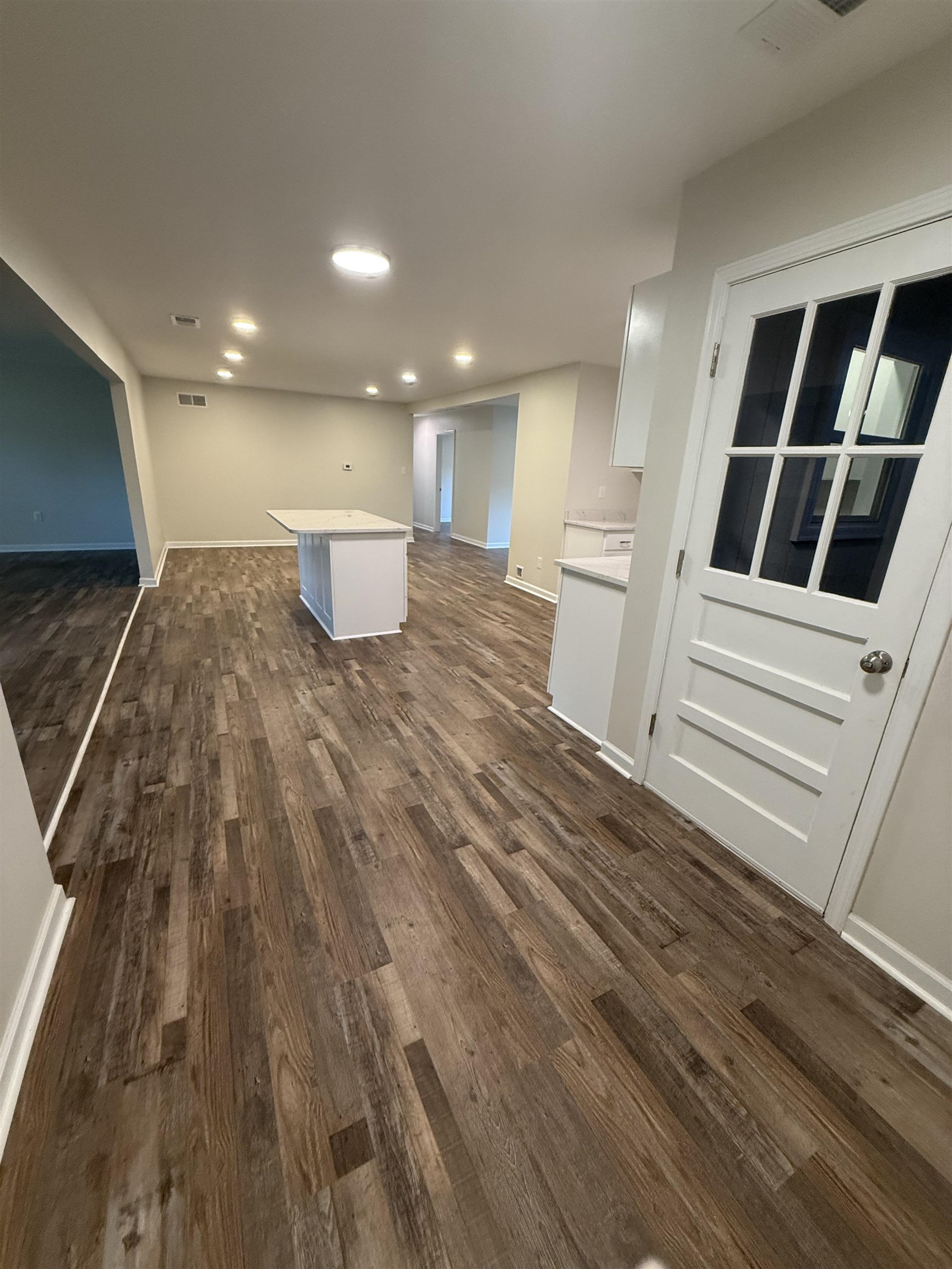 1835 Pleasant Grove Road Moscow, TN 38057 - Photo 34 of 34 Spacious interior featuring wood-finish flooring, recessed lighting, and a kitchen island with a light-toned countertop