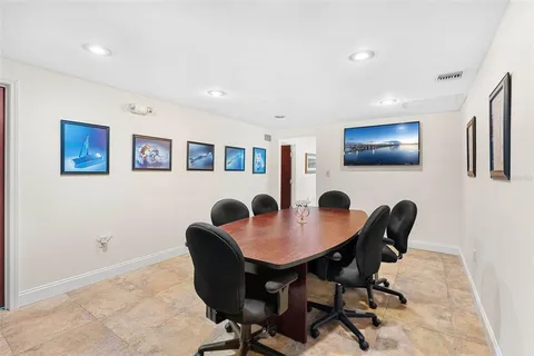 a workspace with furniture and a potted plant