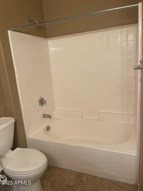 10136 East Southern Avenue, Unit 1070 Mesa, AZ 85209 - Photo 11 of 19 a white toilet sitting next to a bath tub and a shower