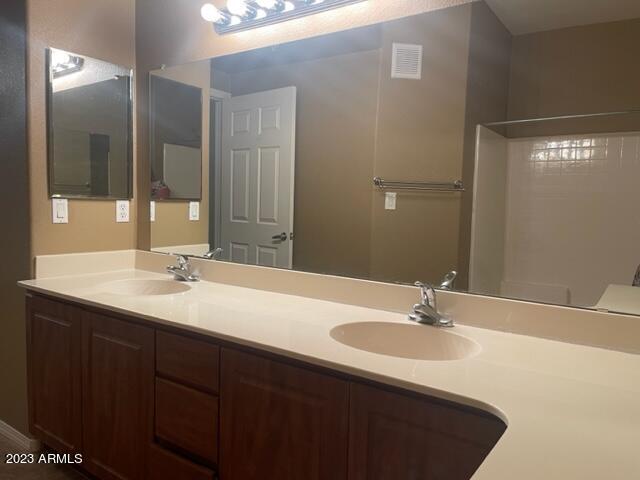 10136 East Southern Avenue, Unit 1070 Mesa, AZ 85209 - Photo 12 of 19 a bathroom with a sink and a mirror