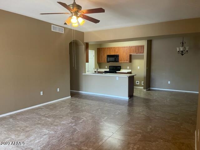 10136 East Southern Avenue, Unit 1070 Mesa, AZ 85209 - Photo 2 of 19 a view of a kitchen with a sink and a refrigerator