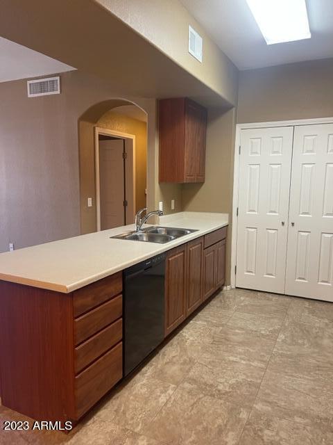 10136 East Southern Avenue, Unit 1070 Mesa, AZ 85209 - Photo 3 of 19 a bathroom with a double vanity sink and a mirror