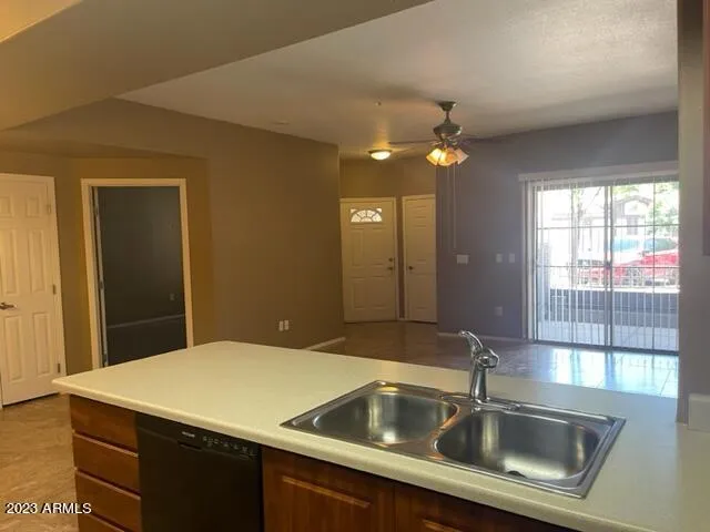 a kitchen with a sink and chandelier