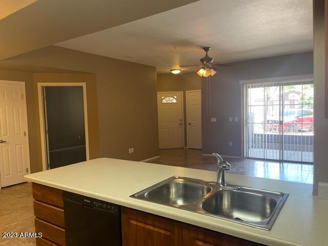 10136 East Southern Avenue, Unit 1070 Mesa, AZ 85209 - Photo 4 of 19 a kitchen with a sink and chandelier