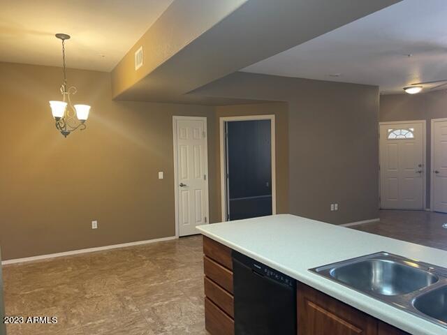 10136 East Southern Avenue, Unit 1070 Mesa, AZ 85209 - Photo 5 of 19 a kitchen with a sink and chandelier