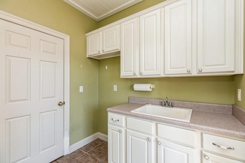 1510 Vinson Ray Road Baker, FL 32531 - Photo 24 of 60 a bathroom with a sink and cabinets