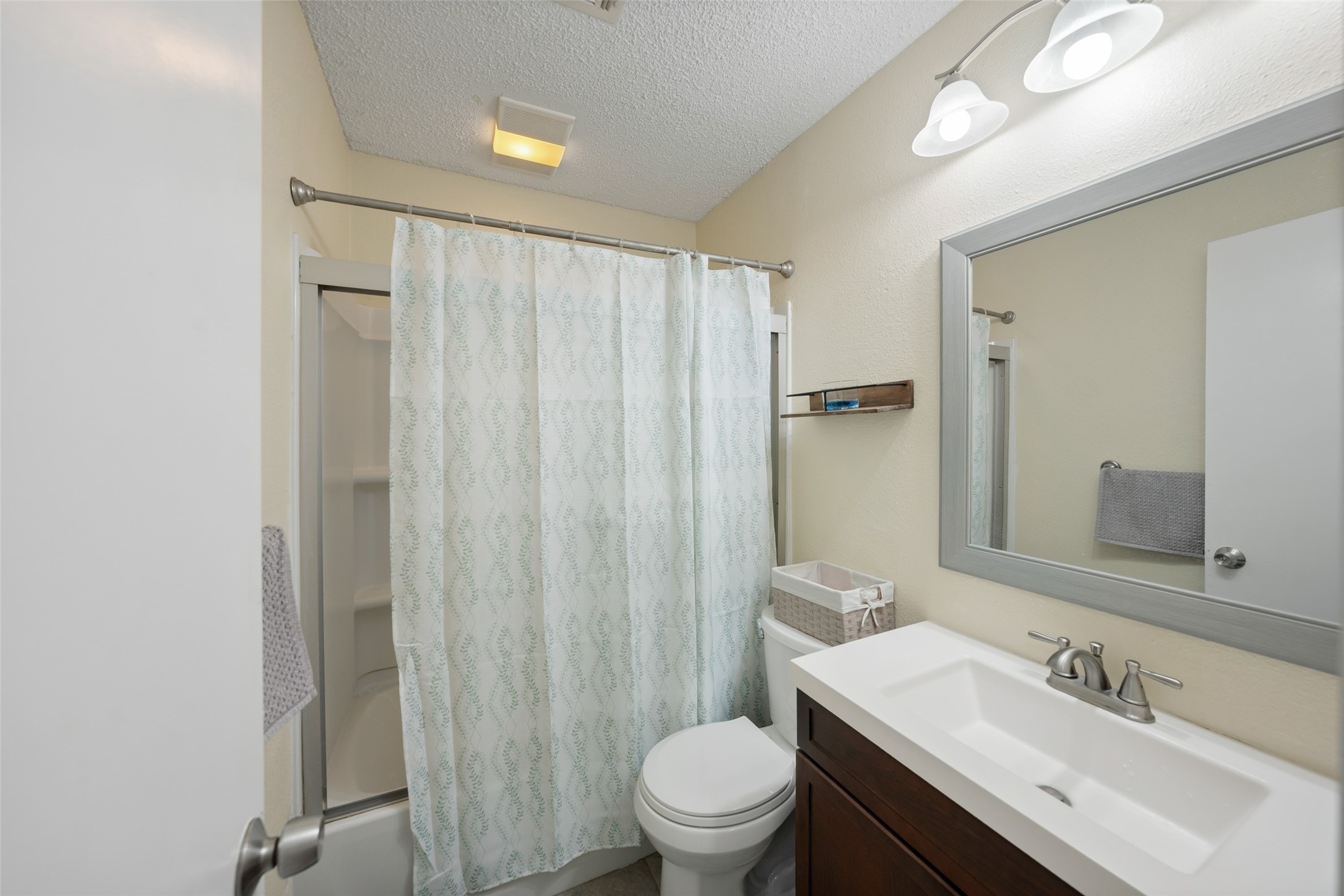 25739 Old Howth Road Hempstead, TX 77445 - Photo 23 of 36 This beautifully refreshed bathroom offers a sleek vanity with a framed mirror and vanity lights above plus a convenient tub/shower combo to make daily routines run smoothly.