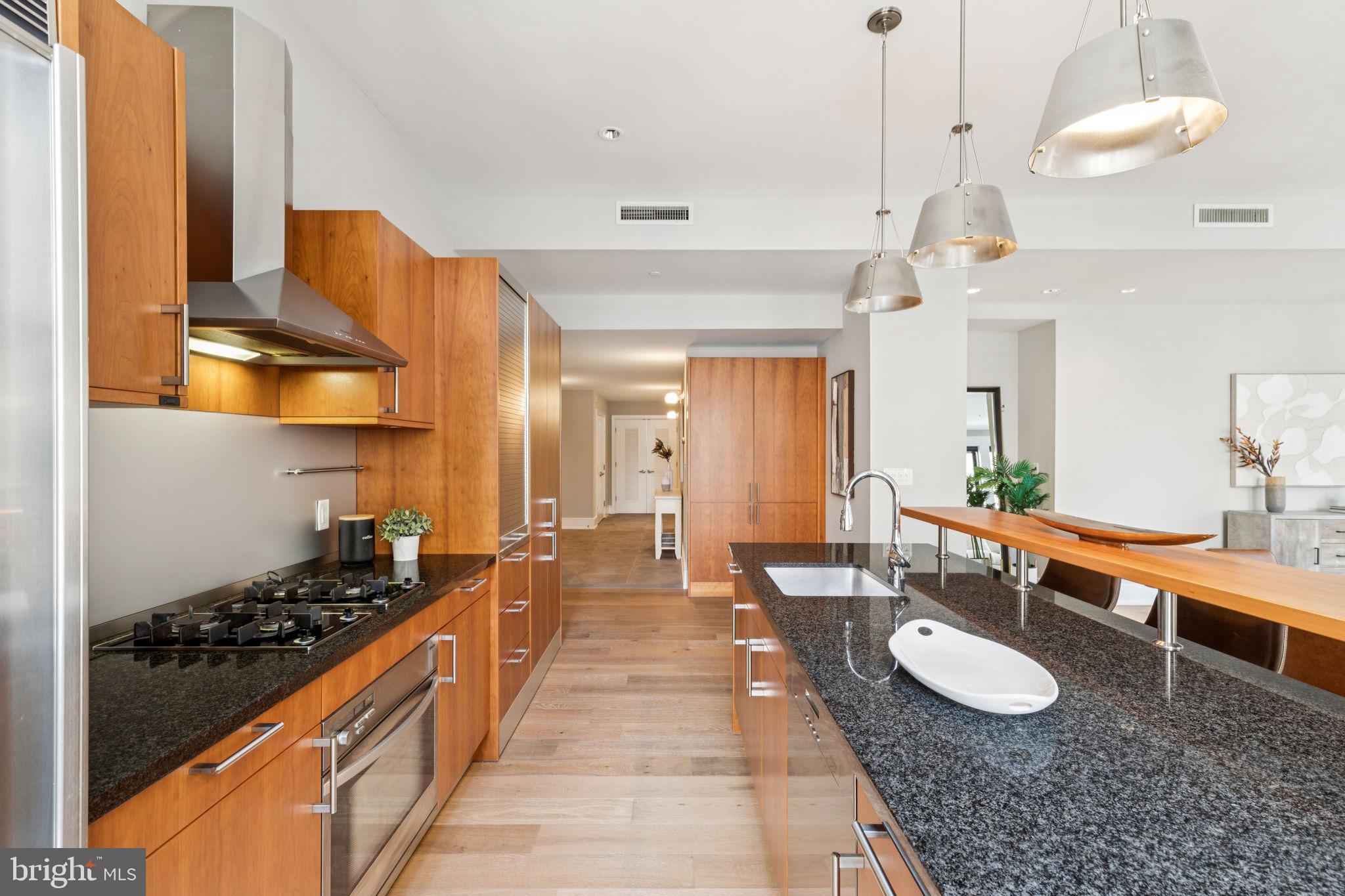1515 Locust Street, Unit 800 Philadelphia, PA 19102 - Photo 15 of 59 a large kitchen with a table and chairs