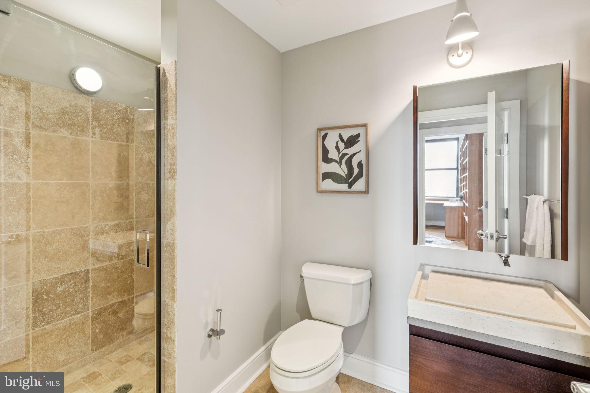 1515 Locust Street, Unit 800 Philadelphia, PA 19102 - Photo 23 of 59 a bathroom with a toilet sink and shower